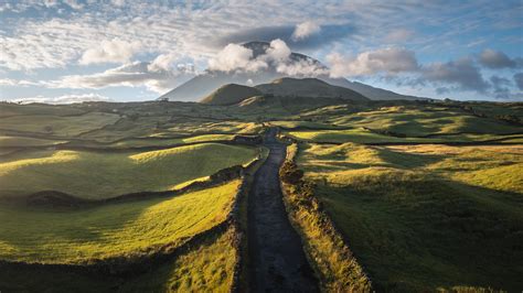 Rural road leading to Mount Pico volcano, Azores islands, Portugal ...