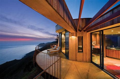 Sunset over the ocean from the modern terrace of the Post Ranch Inn ...