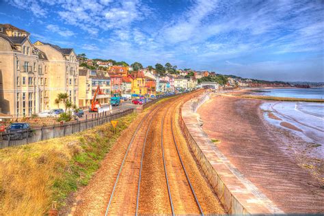 Dawlish Devon England with beach railway track and sea on blue sky ...