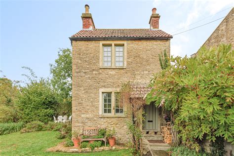 This tiny one-bedroom cottage for sale is surprisingly spacious inside ...