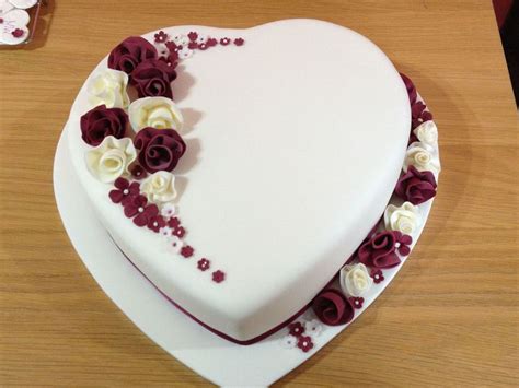 Heart Shaped Wedding Cake With Whimsical Flowers - CakeCentral.com