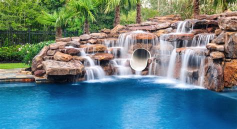 Customize Your Pool With a Beautiful Rock Waterfall - Platinum Pools