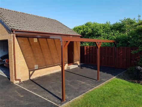 Small carport made from a brown Omega canopy with knee braces | Diy ...