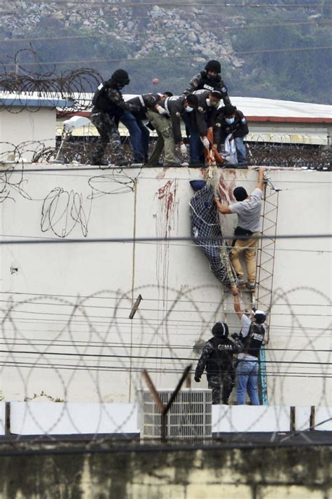 Dozens dead in gun battle between gangs at Ecuador prison - Los Angeles ...