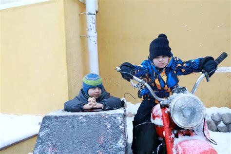 Two Brothers on Motorcycle in Winter Stock Photo - Image of caucasian ...