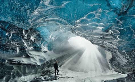 Fall for the otherworldly beauty of Iceland's crystal ice caves deep ...