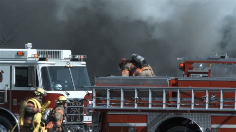 Firefighters Working Together Bringing Supplies To Fire 2 Stock Video ...