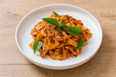 Farfalle pasta with basil and garlic in tomato sauce - Italian sauce ...