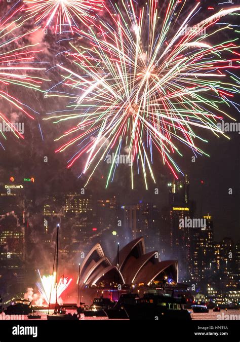 Fireworks over Sydney Harbor with the Sydney Opera House lit up on New ...