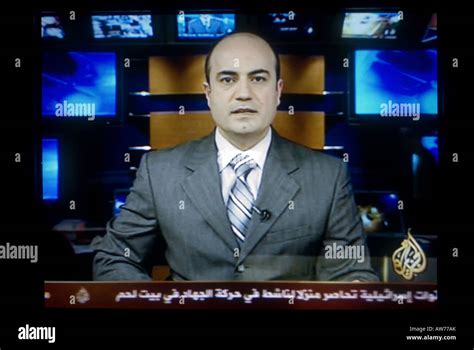 TV screen shot of a news anchor broadcasting live on Al Jazeera' also ...