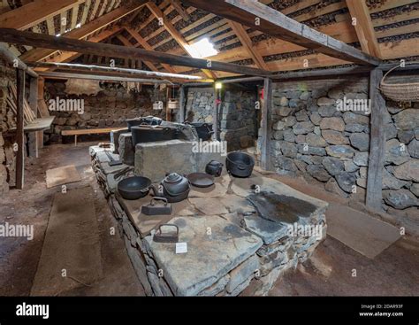 Interior view of pots and pans on an old fireplace in the back Hides on ...