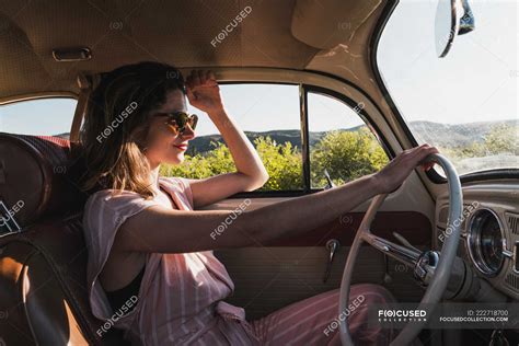 Woman driving a vintage car — journey, trip - Stock Photo | #222718700