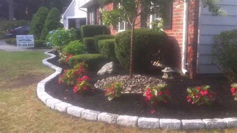 Techo-bloc walls, steps and cobblestone borders with landscape ...