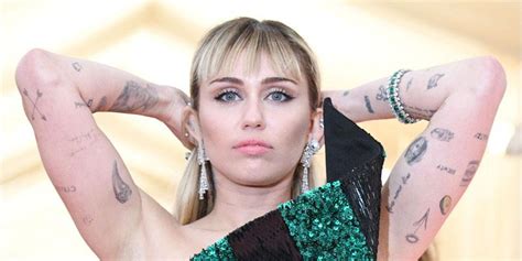 Miley Cyrus Debuts Meaningful Tattoos Amid Break From Boyfriend Cody ...