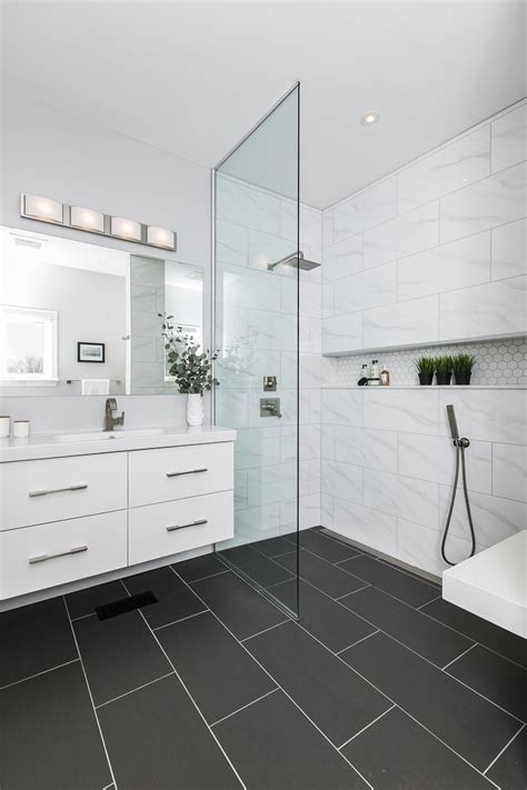 Modern Master Ensuite | Black tile bathrooms, Black bathroom floor ...