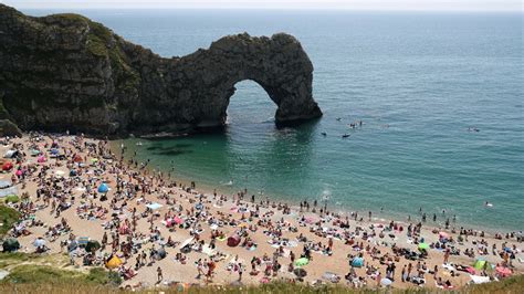 Beachgoers forced to crowd together after three seriously injured in ...