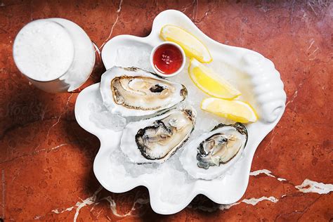 "Plate Of Three Big Oysters, Ready To Be Consumed" by Stocksy ...