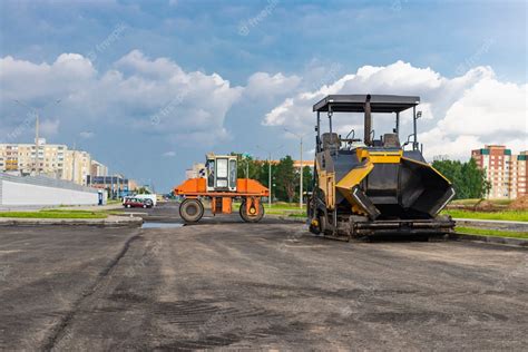 Premium Photo | Asphalt paving equipment. Asphalt paver and heavy ...