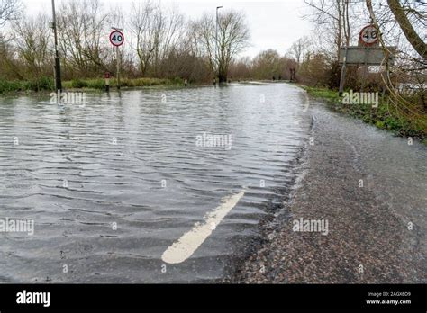 Earith, UK. 22nd Dec, 2019. The River Great Ouse floods roads and ...