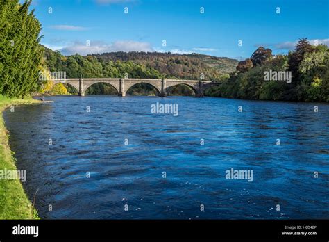 The River Tay flowing under an arched bridge Stock Photo - Alamy