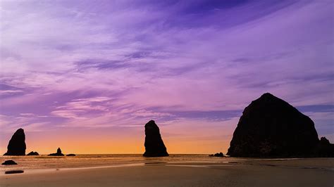 Haystack Rock Sunset At Cannon Beach Photograph by Art Spectrum