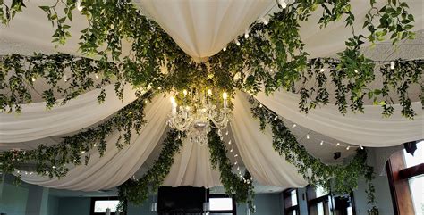 Elegant Ceiling Draping with Greenery and Chandelier