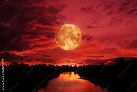 blood moon concept of a red full moon in black sky with cloud. Stock ...