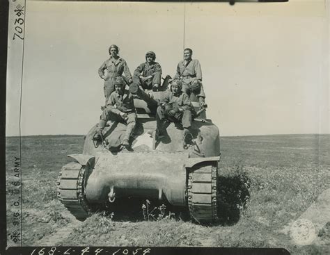 Tank crew with Sherman tank during training maneuvers at Camp Cooke ...