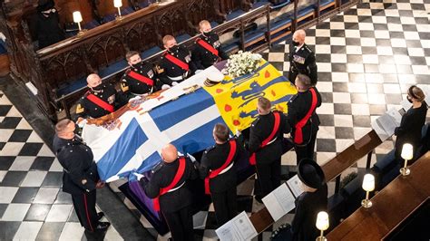 Prince Philip laid to rest as sombre Queen Elizabeth II sits alone ...