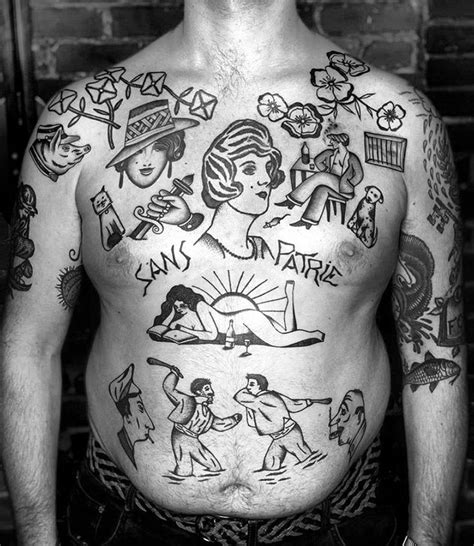 a man with many tattoos on his chest