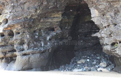 Alcove in beach wall stock photo. Image of cliff, eroding - 160586914