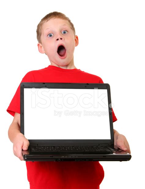 Surprised Boy Holding Computer Stock Photo | Royalty-Free | FreeImages