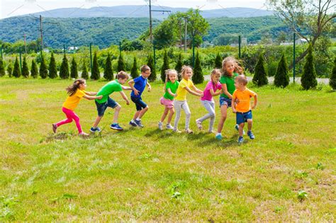 Active children playing yard games | Nature Stock Photos ~ Creative Market