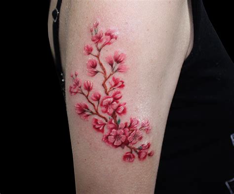 Sakura flowers tattoo | Tattoos, Sakura flower tattoo, Flower tattoos