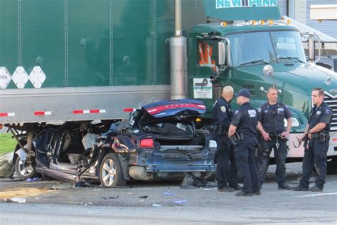 Two critically injured after car crashes into semi truck