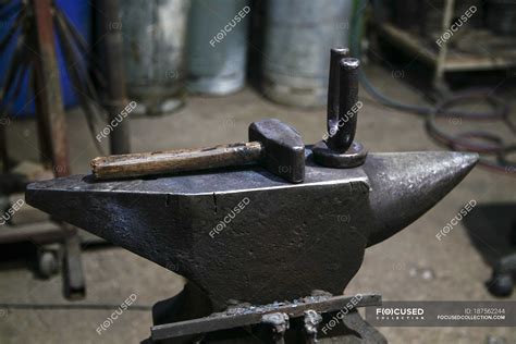 Hammer and anvil in blacksmith forge. — industry, interior - Stock ...