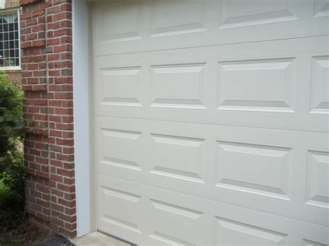 After photograph of completed PVC trim installation of garage door ...