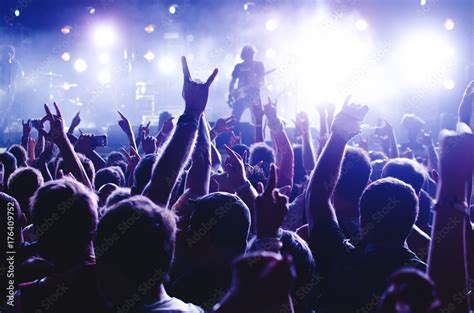 Concert Crowd. Silhouettes young people in front of bright stage lights ...