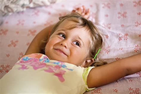 Little Smiling Girl Lying on the Bed Stock Photo - Image of bedroom ...