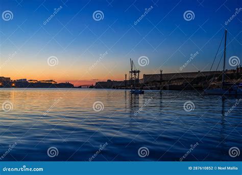 Sunset in the port stock photo. Image of rinella, dock - 287610852