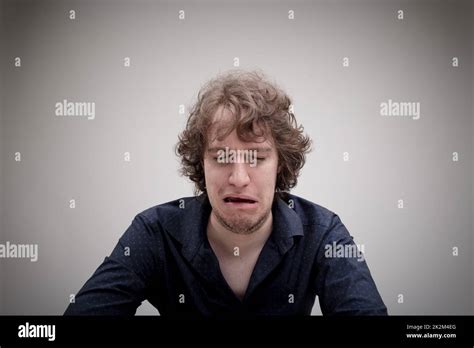 sad man crying in a down despair Stock Photo - Alamy