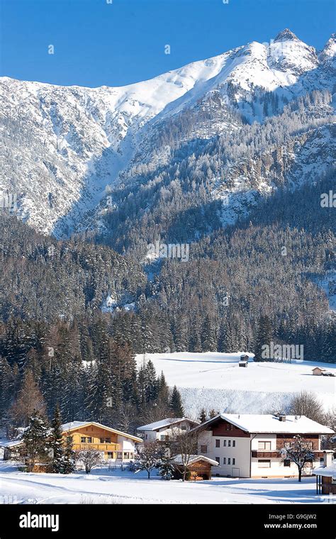 Alpine village in the snow, Austria Stock Photo - Alamy