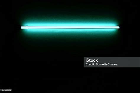 Light Blue Neon Lights On White Wall At Night Stock Photo - Download ...