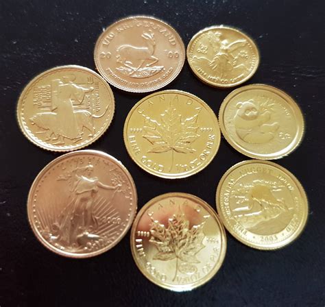 A collection of very small gold coins from around the world. 1/20 and 1 ...