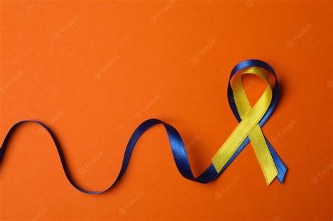 Premium Photo | Down syndrome awareness ribbons on orange