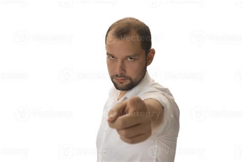 Portrait of young man pointing forward, looking at camera. Choosing ...