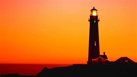 Lighthouse silhouette in the sunset - backiee