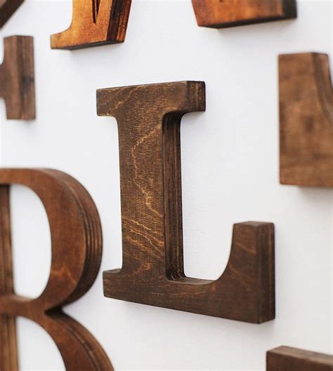 wooden letters are mounted on the wall