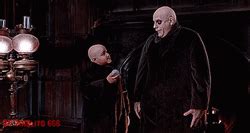 Addams Family Uncle Fester Weird Light Bulb GIF | GIFDB.com