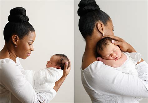 Black mom lovingly looking and holding sleeping newborn baby in ...